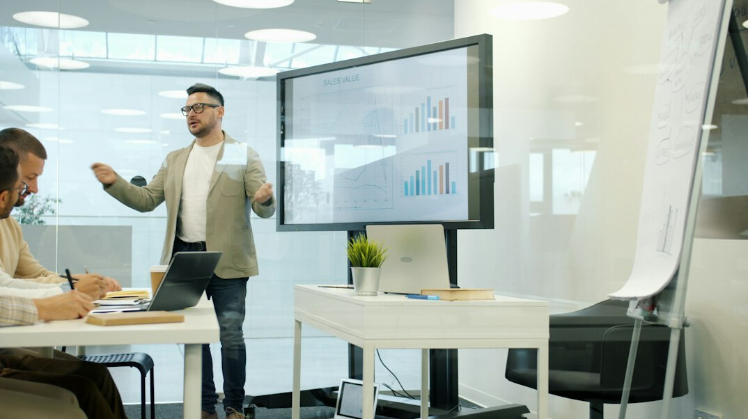 business meeting with analytics charts