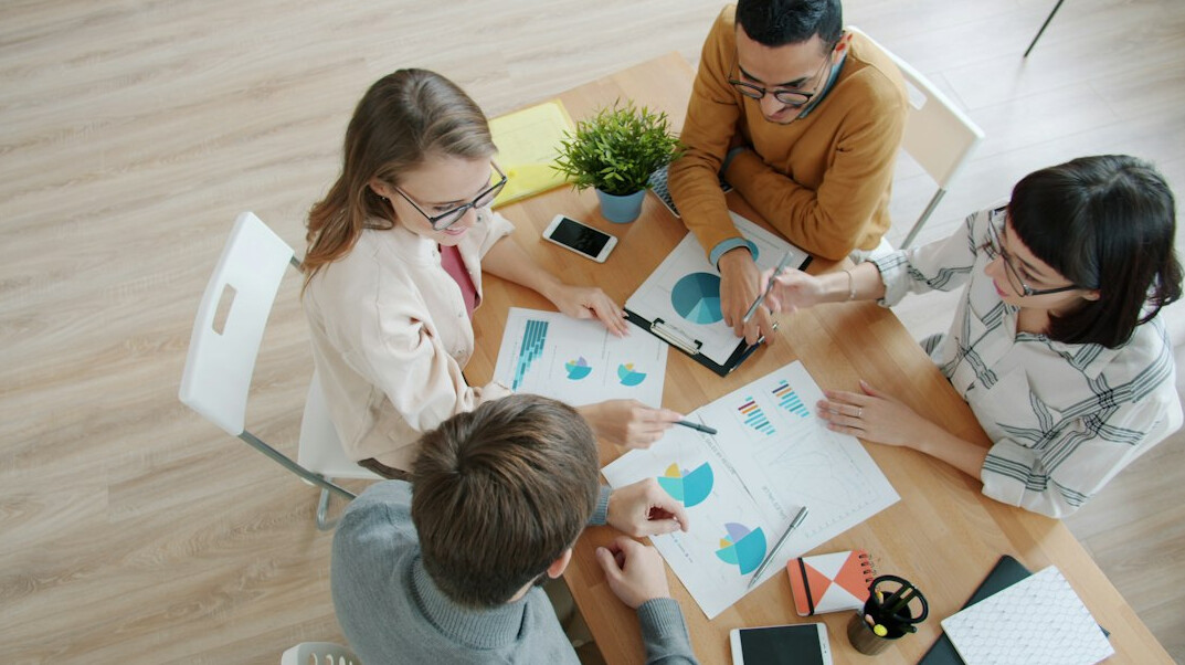 collaborative meeting with charts