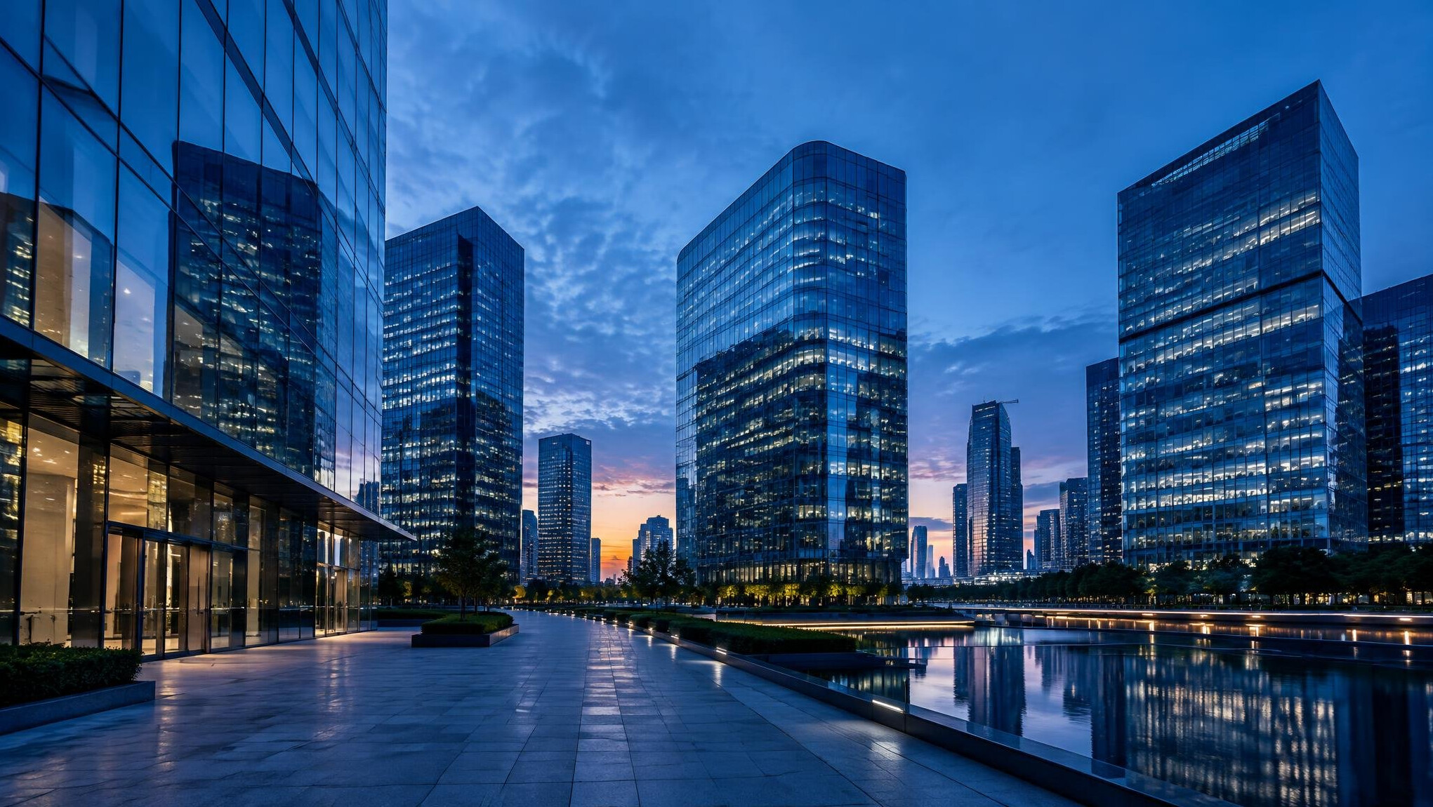 Modern glass office buildings at dusk